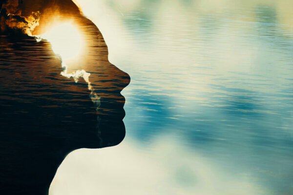 Woman silhouette with sun in head with copy space. Multiple exposure image. Woman silhouette with sun in head with copy space. Multiple exposure image.